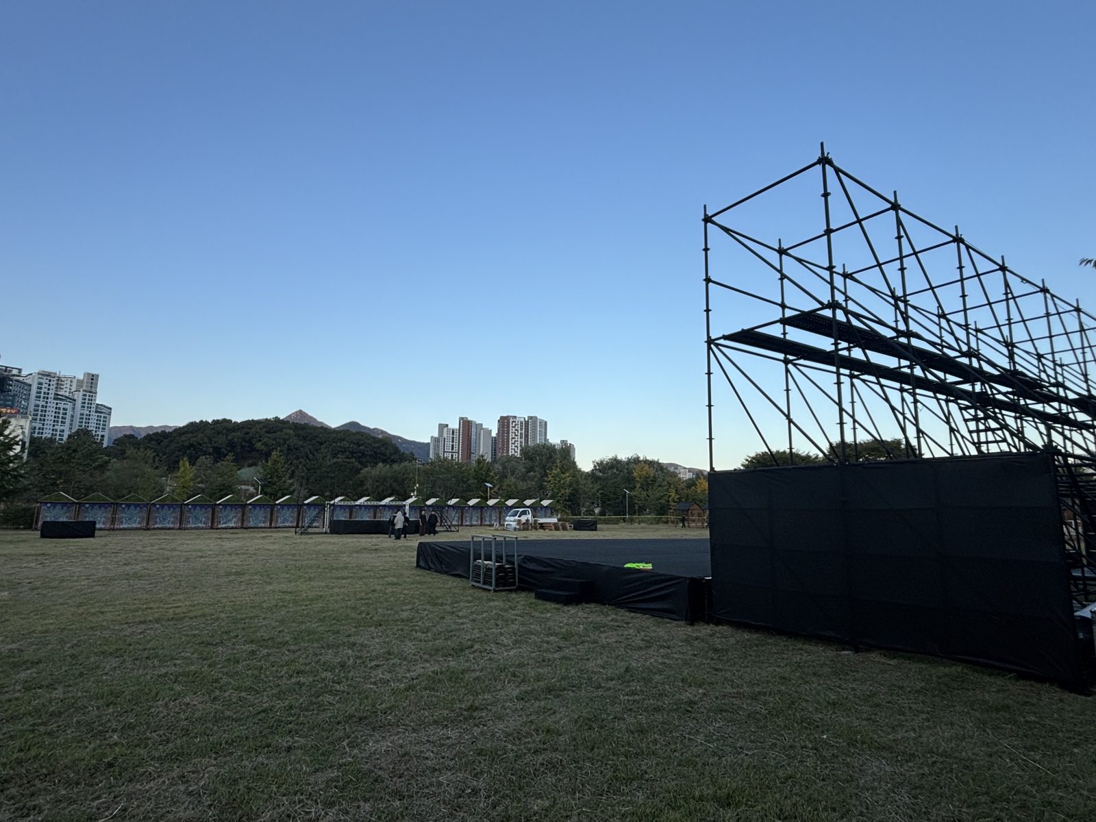 Large back structure behind the stage — outdoor park stage, Oct 2026